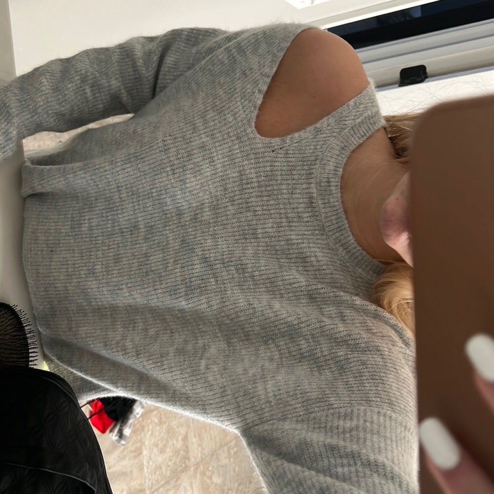 Grey sweater, hole in the shoulder